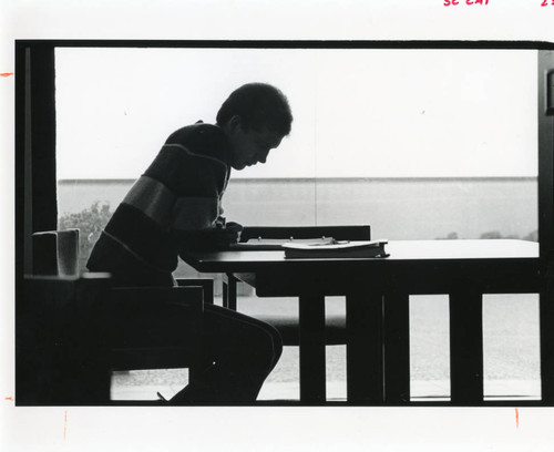Student studying in Payson Library, circa 1986