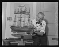 Hugh Wilson repairs a model ship, Los Angeles, 1935