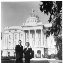 View of movie actors Dean Martin and Susan hayward standing in front of the California State Capitol building