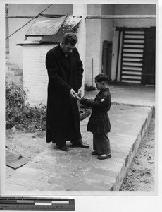 Fr. John McLoughlin at Wuzhou, China, 1948