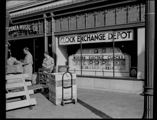 People lined up at a frequency change "Clock Exchange Depot" at the Santa Barbara Music Company
