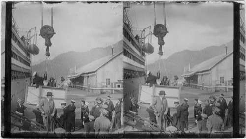 Mrs. Harding goes abroad in her special elevator which lifts her to the top deck. She is assisted by Cap't Andrews, Cordova, Alaska