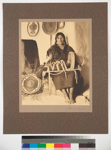 Hopi woman with baby, showing cradle in use among these people