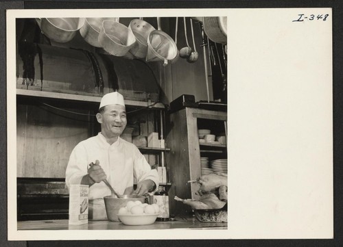 Mr. Tsunayoshi George Kaneda, Issei, is shown at his work at the Hotel Whittier in Philadelphia, Pennsylvania. Mr. Kaneda is