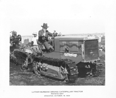 Crawler Tractors - Stockton: Luther Burbank driving Caterpillar Tractor, Potato Day, two unidentified men in the background