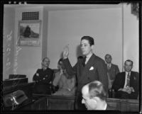 Ross Alexander raises his hand in testimony, Los Angeles, 1935