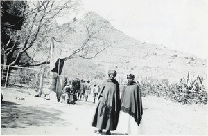 Two African women in the front of the Lekhoele station's entrance