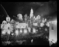Night time view towards the House of Charm and tower of the Palace of Science at the California Pacific International Exposition, San Diego, 1935-1936