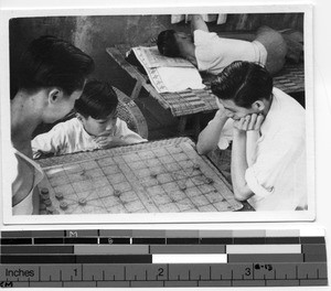 Boys playing board game in Stanley, Hong Kong, China, 1939