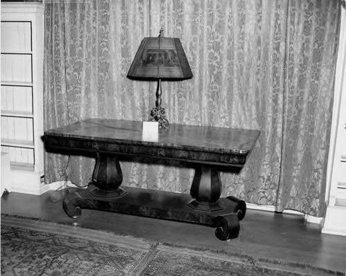 Table, lamp- in front of drape