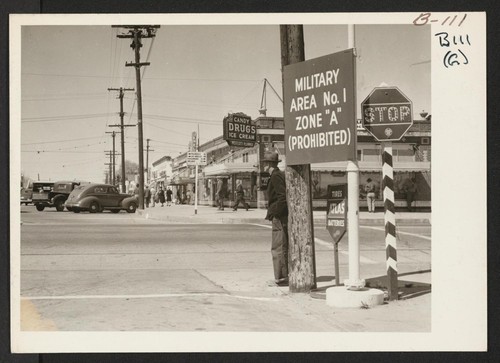 Sign on main street designating military zone. Photographer: Albers, Clem Lancaster, California