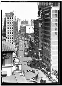 View looking north to a parade on Broadway from the Chamber of Commerce building, Los Angeles, April 26, 1928