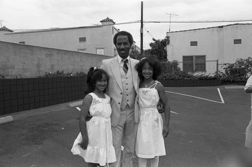 Donald Bohana posing with his daughters, Los Angeles, ca. 1986