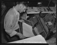 Printer R. T. Allen works on a braille copy of "Mutiny on the Bounty", Los Angeles, 1936