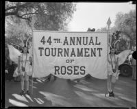 Two girls dressed as butterflies carrying the banner announcing the Tournament of Roses Parade, Pasadena, 1933