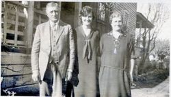 Three unidentified family members, probably father, mother and adult daughter