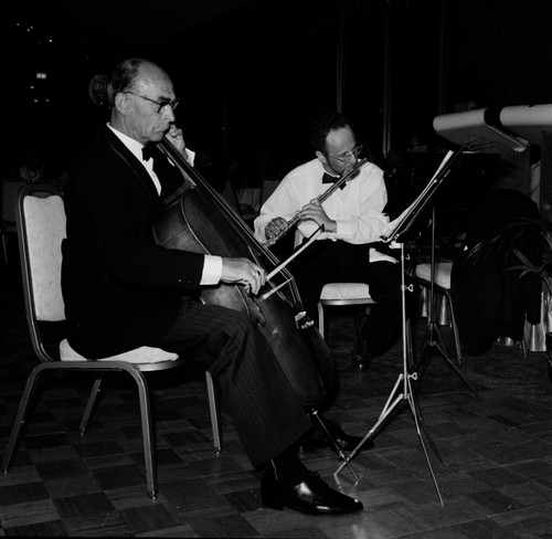 Image depicts some of the orchestra members playing at the UCSD Faculty Ball. April 25, 1970