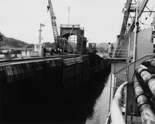 The D/V Glomar Challenger (ship) at right, passing through Panama Canal locks during the Deep Sea Drilling Project. 1979