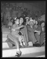 Sharon Ann Matsuzaki waves to her father marching in Victory in Japan Day parade; Los Angeles, Calif., 1948