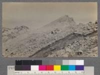 On the rim of the crater of Mt. Lassen. Material in the lower right-hand corner is still slowly moving down the mountain side. July 19, 1918