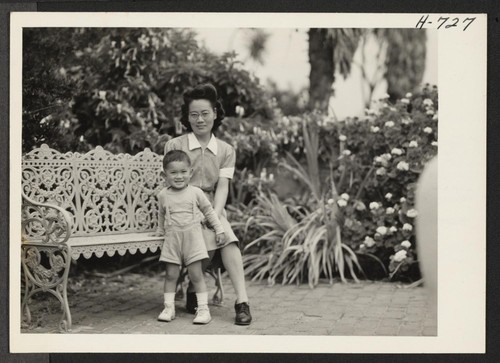 Mrs. Miyeko Fukusawa and her two-year-old son, Johnny, at the home of Mrs. Buell Hammet in the hills overlooking Santa
