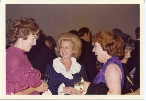 Mrs. Helen Young speaking to two ladies