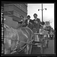 Three Los Angeles officials riding the 73rd anniversary Union Rescue Mission's Gospel Wagon, 1964