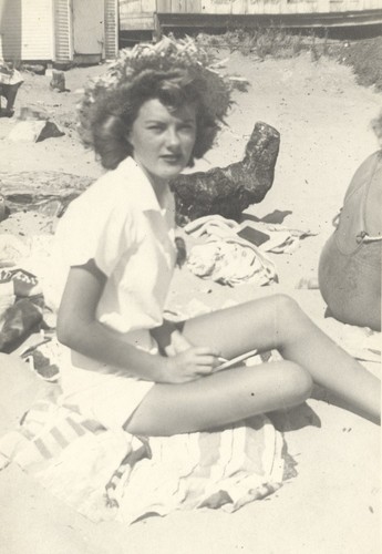 Barbara Merrell in sun hat at Cowell Beach