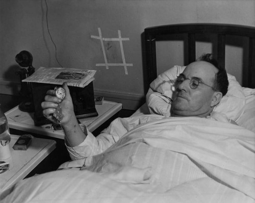 Harry Raymond in hospital bed