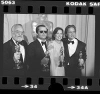 Saul Zaentz, Jack Nicholson, Louise Fletcher and Michael Douglas posing with their Oscars at the 1976 Academy Awards