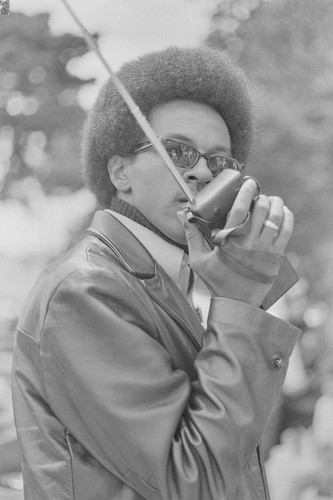 Black Panther with Walkie Talkie, Free Huey Rally, at De Fremery Park, Oakland, CA, #18 from A Photographic Essay on The Black Panthers