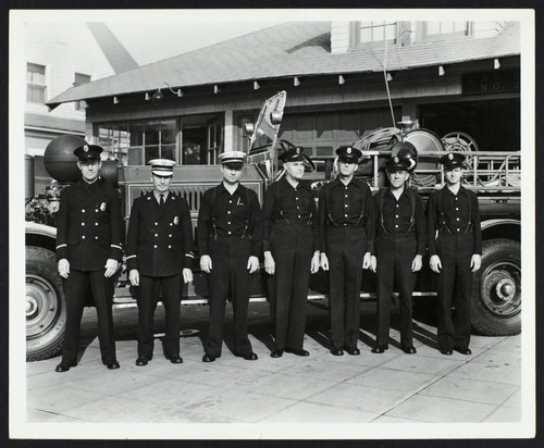 Personnel stand alongside fire engine in front of Station No. 2 on Appleton St