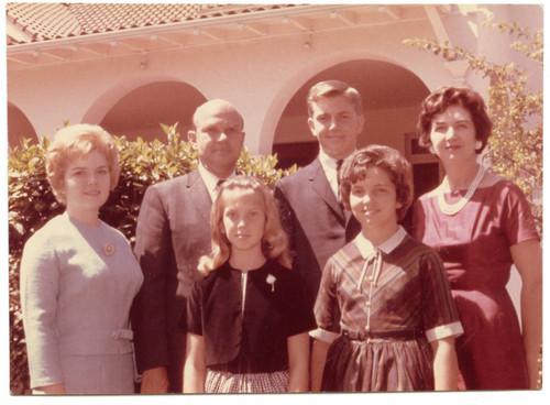 Young family portrait in front of the President's Home, 1964