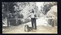 Man posing with Bernese mountain dog