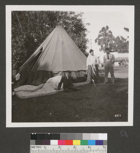 [Refugees at tent. Unidentified camp.]