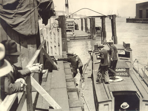 [Men climbing the dock during waterfront strike]
