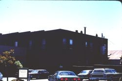 Rear of Don's with the parking lot visible, July 1976