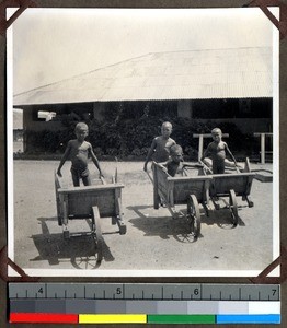 Boys ready to race in wheel barrows at Shendam Mission, Nigeria, 1923