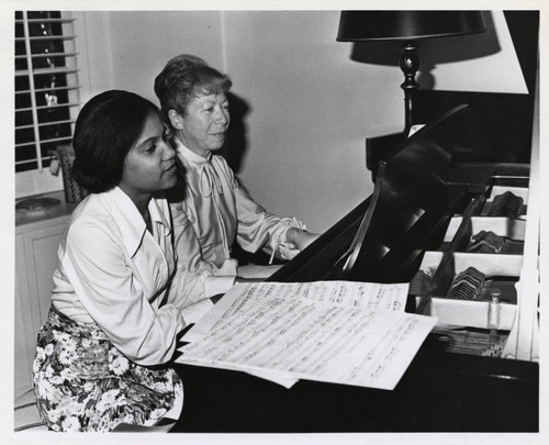 Two women playing piano, Scripps College