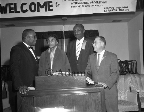 Four people at podium, Los Angeles, ca. 1962
