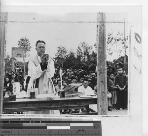 Fr. Tennien holding Mass at village at Cenqi, China, 1948