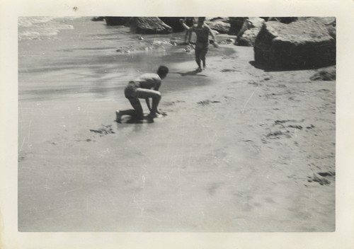 Unidentified men on Cowell Beach