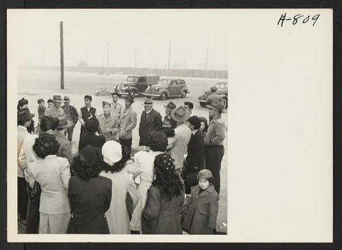 Master Sergeant Charles Akiyama, acting as the liaison personnel at the Port of Los Angeles, briefs a group of Japanese