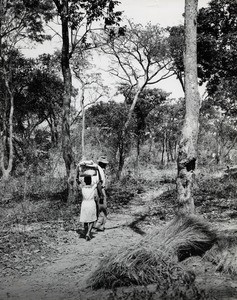 A father accompanying his daughter from their village to the Girls' School for African people in Mindolo, Northern Rhodesia