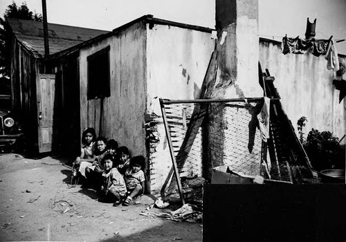 Children in front of dwelling exterior