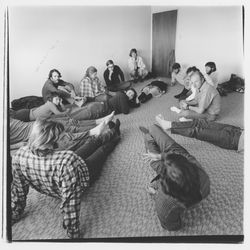 Group of students in an encounter session or group exercise sprawl on the floor in a Jung Haus student housing appartment at Sonoma State University in Rohnert Park, California, 1971