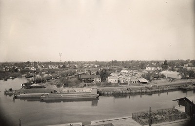 Stockton - Harbors - 1900s: View of channel, with barge Eva at pier-side