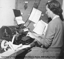 Mrs. Dowell at teletype machine at the Mill Valley Record, 1958