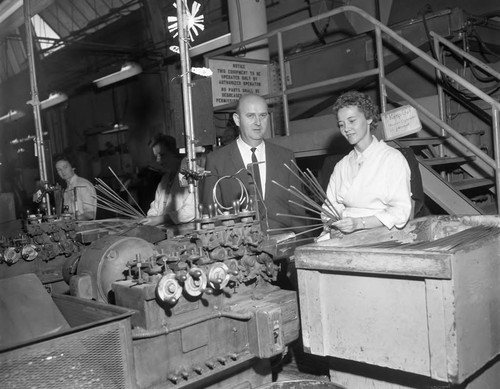 Gordon Hahn looking at equipment, Los Angeles, 1962