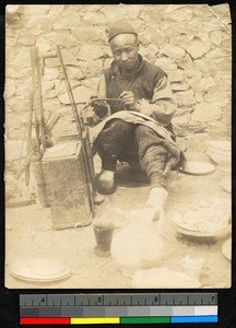 Man repairing pottery, Shandong, China, ca.1895